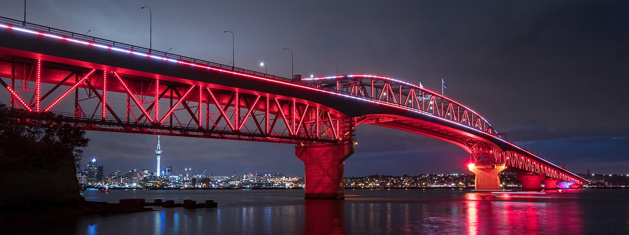 Auckland's Harbour Bridge shines as it is lit up by Vector Lights