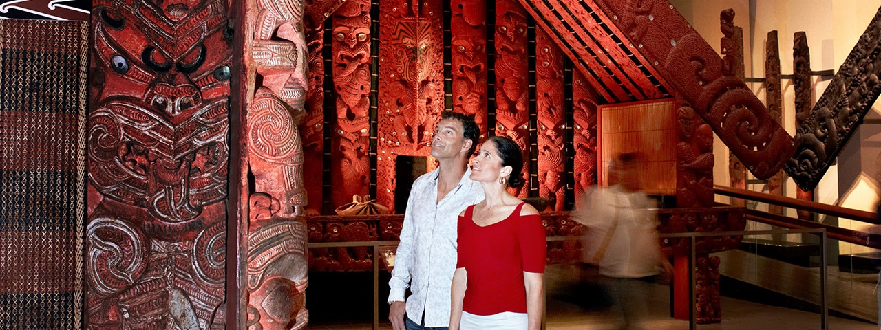 A couple in awe at Auckland Museum's Maori exhibition