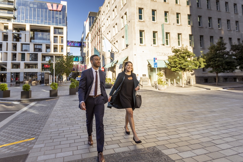 Two business people walking through Auckland city