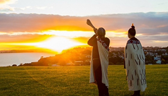 Two people wearing Korowai, traditional Māori woven cloak - Rukuhia experience